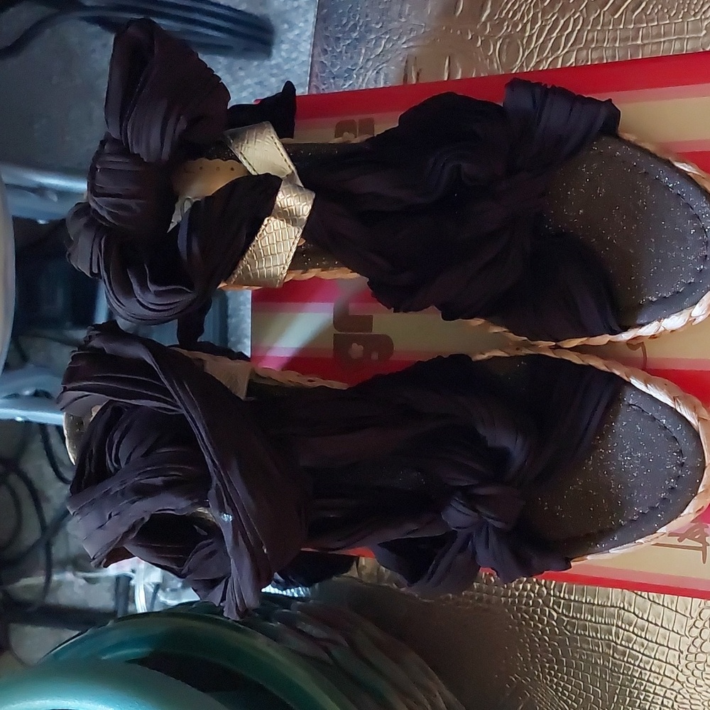 Wedge sandals with dark brown fabric and braided grass detail